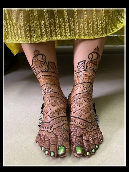 Traditional peacock designs for the feet. The symmetrical patterns create a beautiful look when the feet are placed together.