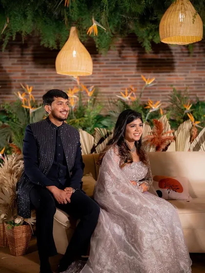 A candid moment of laughter between Yeshaswini and Shashank. We designed a boho-chic backdrop with cane lanterns and birds of paradise that perfectly matched their relaxed and happy vibe.