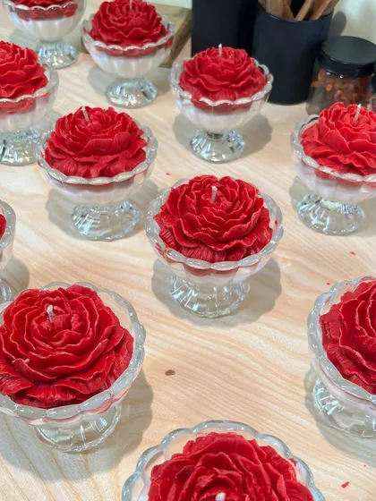 A bulk order of my red peony candles in glass jars, ready to be packed for a wedding. They add a touch of romance and elegance to any event.