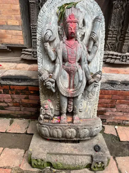 An ancient stone carving of a deity in Bhaktapur. The city is renowned for its artisans and the intricate details of its sacred art.