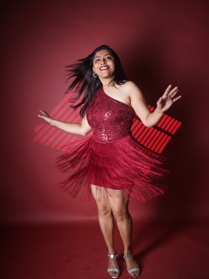 Another shot of the red fringe dress in motion. This captures the dynamic energy I bring to every stage I step on.