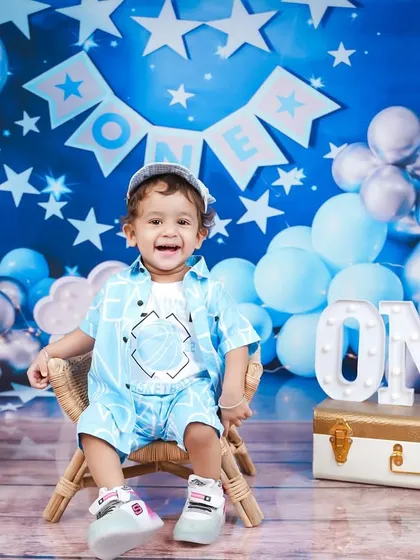 Another angle of the starry blue first birthday theme, showing the full setup with balloons and decorations.