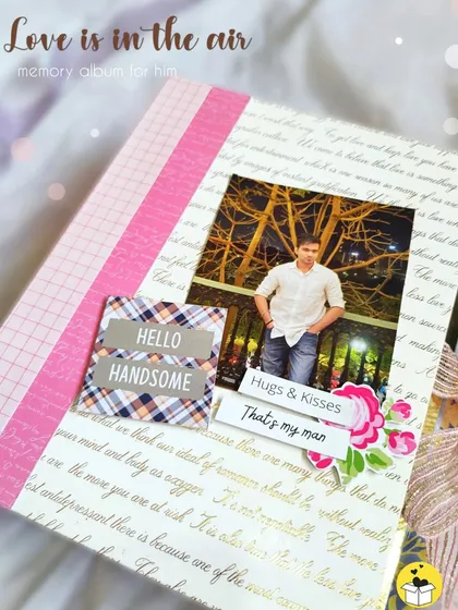 The cover of a 'Love is in the air' memory album, designed for him. It holds 25-30 photos and is full of surprises.