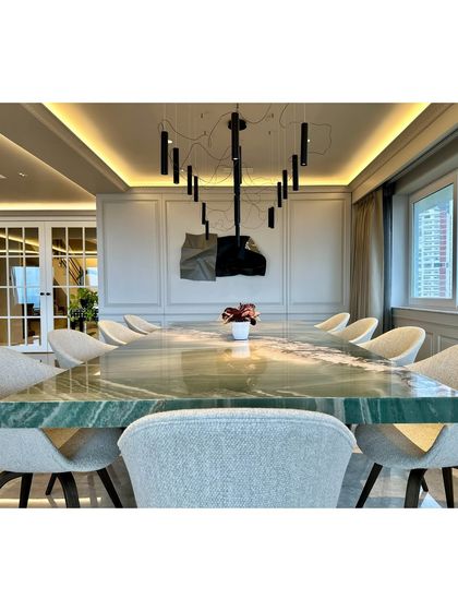 A head-on view of the stunning dining table, with my sculpture providing the perfect artistic backdrop.