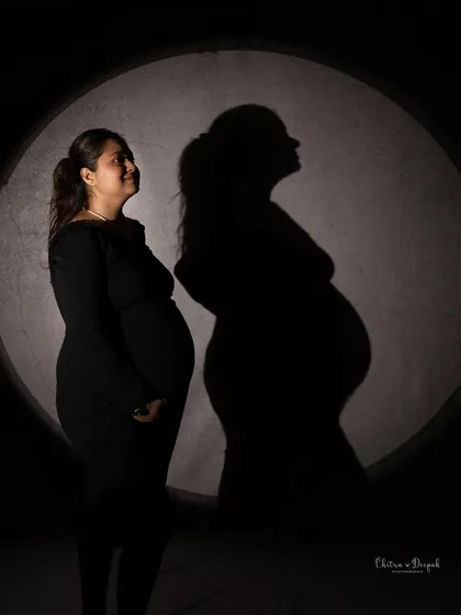 Artistry is at the heart of what we do. This creative silhouette shot plays with light and shadow to create a dramatic and intimate portrait that focuses on the beautiful form of motherhood.