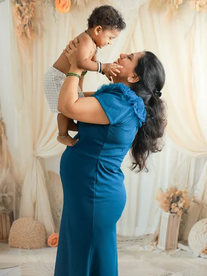 This is the heart of it all. Celebrating the love that fills a home as it prepares to welcome a new life. This beautiful mother-to-be shares a joyful moment with her first child, a perfect memory captured during a family maternity session with a soft, boho-inspired setup.