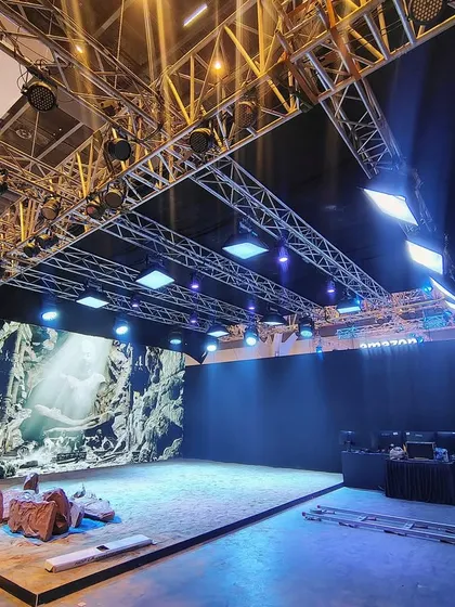 A wide-angle view of our demonstration stage at WAVES 2025. This shot captures the full setup, including the LED wall, the overhead lighting rig, and the physical set elements, ready for a live shoot.