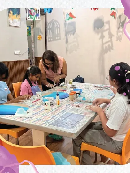 I'm providing guidance to a group of students during a resin art class. I ensure everyone understands the steps and can work safely to create their beautiful pieces.
