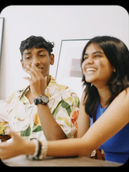 On World Laughter Day, we celebrate the joy that fills our cafe. Here's a candid shot of friends sharing a laugh.