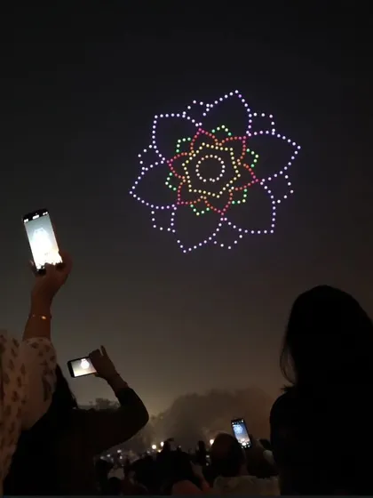 Inspired by Ayodhya’s Deepotsav, our drones danced above the 2 lakh diyas at Delhi's Dilli Deepotsav. This image captures the crowd's wonder as a floral rangoli lights up the sky.