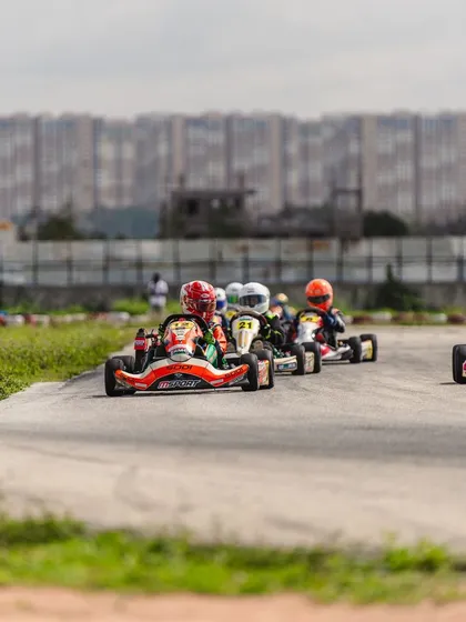 A train of karts snakes through a section of the track, demonstrating the close-fought nature of our races.