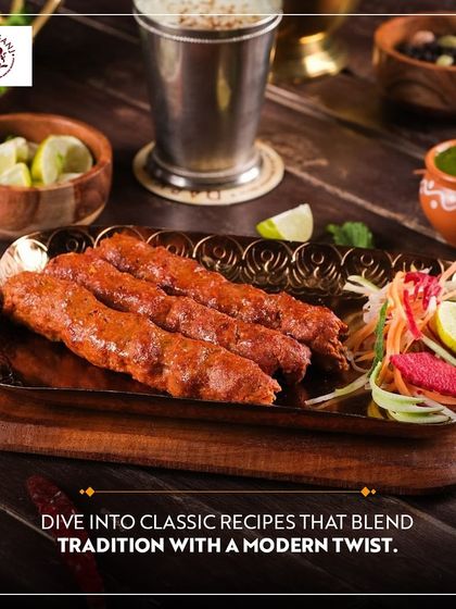 Dive into classic recipes that blend tradition with a modern twist at Daryaganj. These succulent seekh kebabs, served on a traditional platter, showcase the heritage of Indian culinary arts.