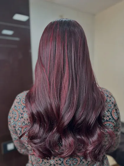 The full back view of this stunning cherry red hair. The color is even, vibrant, and incredibly shiny.