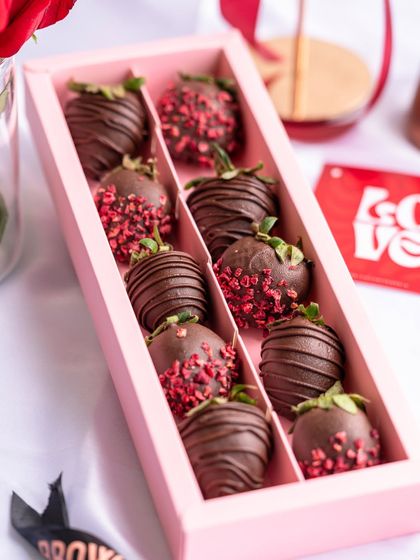 A box of my chocolate-covered strawberries, some drizzled with more chocolate and others sprinkled with freeze-dried raspberries. A classic, indulgent Valentine's treat.