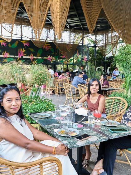 A group of ladies enjoying their time at one of our tables. It's the perfect spot for a catch-up session over lunch or drinks.