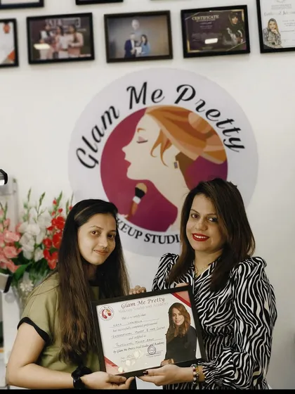 Presenting a certificate to one of my dedicated students. This moment marks the beginning of her professional journey as a makeup artist.