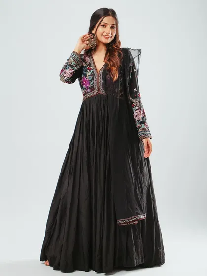 A full-length shot of a beautiful black Anarkali gown with colorful embroidery. This is for a brand lookbook, shot on a clean white background.