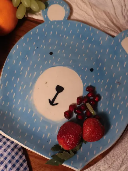 Beyond classic tableware, I love creating playful pieces like this bear-faced plate. It's perfect for making breakfast fun or serving snacks with a smile, showing that handmade pottery can be both beautiful and whimsical.