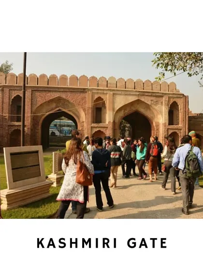 A group of curious explorers stands before Kashmiri Gate, a site central to the 1857 Revolt. I am explaining its strategic importance and the visible battle scars that tell a powerful story of rebellion and reclamation. These walks bring textbook history to life on the very ground where it happened.