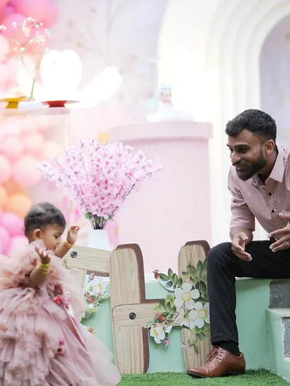 A sweet, candid moment between a father and his daughter at her enchanted fairy garden-themed birthday party. These are the precious memories we love to help create.