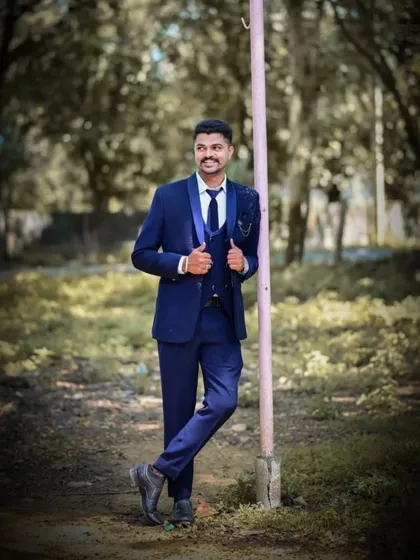 I make sure the men look just as sharp. Here is a client looking dapper in a classic navy blue three-piece suit from my men's rental collection, perfect for a reception or a coordinated couple's shoot.