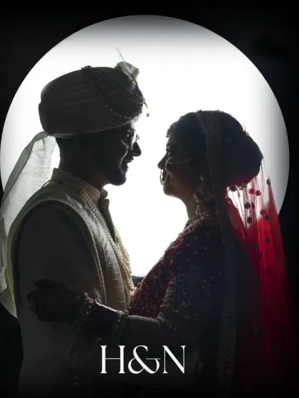 A creative silhouette of the bride and groom against a full moon backdrop, creating a romantic and artistic wedding portrait.
