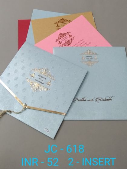 This simple and affordable invitation comes in several pastel colors like blue, pink, and yellow. The gold tassel adds a touch of festive charm.