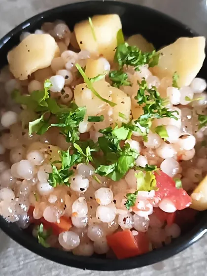 A single serving of my Sabudana Khichdi, garnished with fresh coriander. It's light on the stomach but very satisfying.