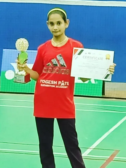 Another proud moment for Aditi Yadav, showcasing her certificate and trophy from the Palava State Tournament.
