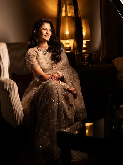 An elegant portrait of the bride in her shimmering grey saree for her Walima.