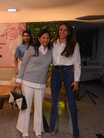 Posing with an attendee at the Udana Wellness event. It was wonderful to connect with so many people interested in yoga and preventive care.