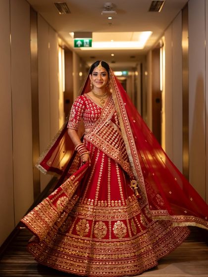 The perfect bridal twirl. This shot shows how the entire look, from the flowing lehenga to the glowing makeup, comes together to create a magical moment.