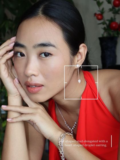 A full look at our dainty jewellery collection, featuring heart-shaped droplet earrings, a gold and silver Cuban bracelet stack, and our unique Y-shaped diamond pendant.