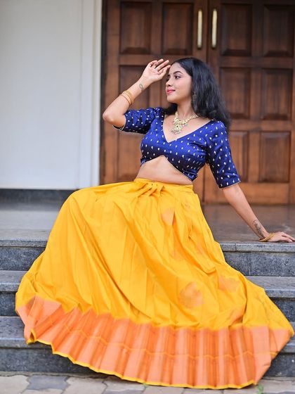 The model posing gracefully on the steps.