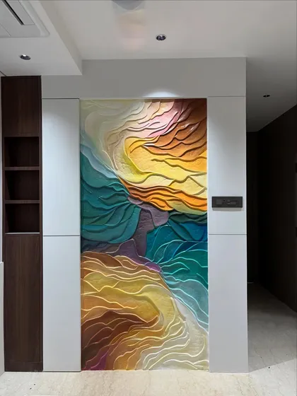 I love playing with texture and color to create abstract art that radiates energy. This 3D wave effect mural uses sculpted layers and a sunset-inspired palette to bring a dynamic and modern feel to the room.