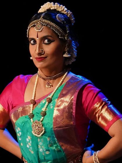 My student Shriranjani in a powerful stance during her performance. The traditional temple jewelry and vibrant silk costume are integral parts of the Arangetram presentation.