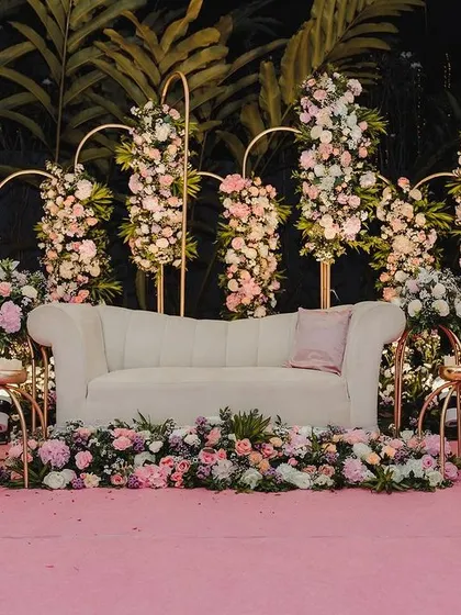 Bhumi dreamt of a fairytale reception, and we made it a reality with this romantic stage design. We used elegant gold arches and a cascade of pastel roses and hydrangeas against a soft pink backdrop to create a dreamy, love-filled setting.