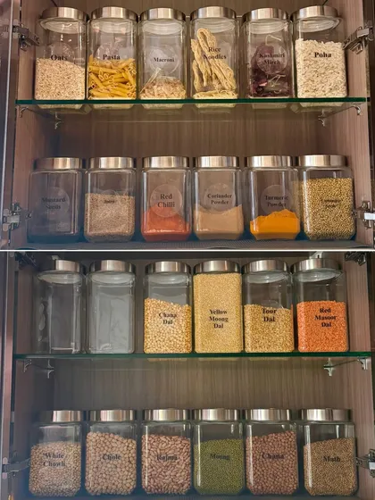 Imagine a pantry where every dal, grain, and snack is visible and fresh. We use decanting and clear labeling to create a system that prevents duplicate purchases and makes finding ingredients a breeze.