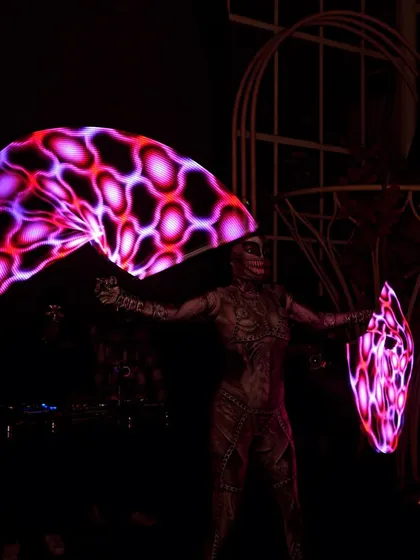 Channeling a cyberpunk theme with programmable pixel fans for a Halloween event. These high-tech props can display intricate patterns and logos, offering a fully customizable light show for any theme.