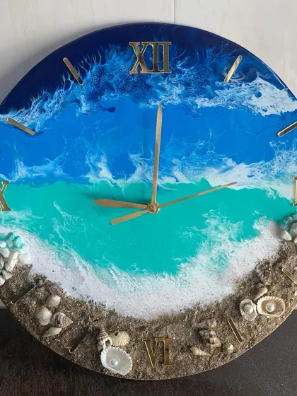 Another view of an ocean-themed clock, showing the detail of the real sand and shells along the bottom edge. I use multiple shades of blue and turquoise to capture the depth of the sea.