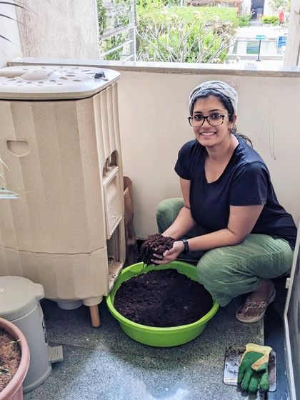 The joy of the first harvest. A proud Terrabite owner shows off the rich, dark compost she made in her own home. This is the rewarding result of a simple daily habit.