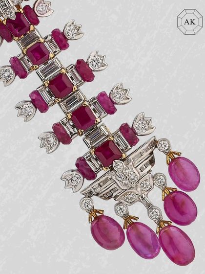 A bold celebration of brilliance. These statement earrings feature three forms of rubies paired with four shapes of diamonds in rich 18k gold.