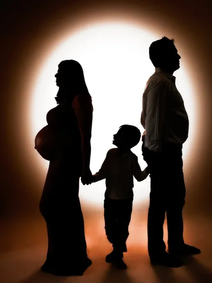 This is more than a photo; it's a story told in shadow and light. I wanted to create a powerful, artistic silhouette that captures the feeling of a family on the brink of a new chapter, with their first child looking up to the future they are building together.