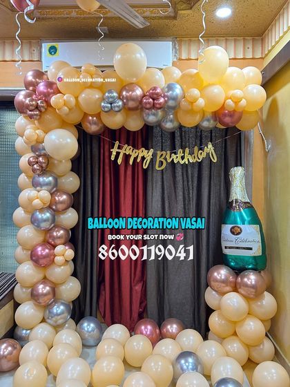 A simple and elegant balloon arch in peach and chrome gold. This setup is perfect for adding a festive touch to any corner of your home.