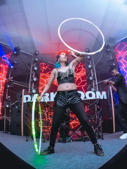 On stage at the Darkroom music festival, vibing with the music and the crowd. Performing with LED hoops on a large stage allows me to create big, bold patterns that fill the space and match the energy of any musical act.
