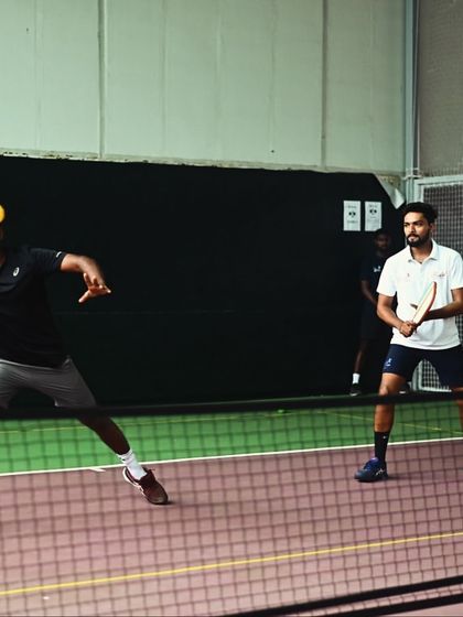 A doubles match in full swing. Pickleball is a social sport, perfect for a friendly but competitive game with friends.