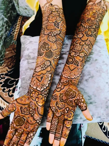 A stunning bridal design with full coverage, featuring the name 'Faraz' on the palm. The rich color and detail are perfect for a bride.