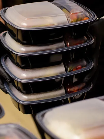 A stack of our daily meal boxes, ready for delivery to a corporate office. Each container is sealed to ensure freshness and hygiene, making our service a reliable choice for daily office meals and corporate catering in Bangalore.