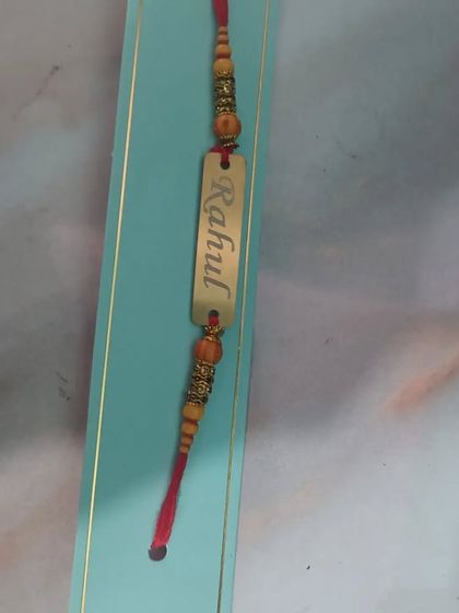 A personalized metal name Rakhi, another beautiful option to make your brother feel special.