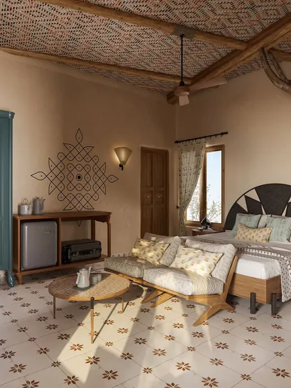 I incorporated traditional Indian art forms like the *kolam* pattern painted on the wall. This detail serves as a cultural anchor, grounding the room in its location while complementing the modern, earthy furniture and textiles.